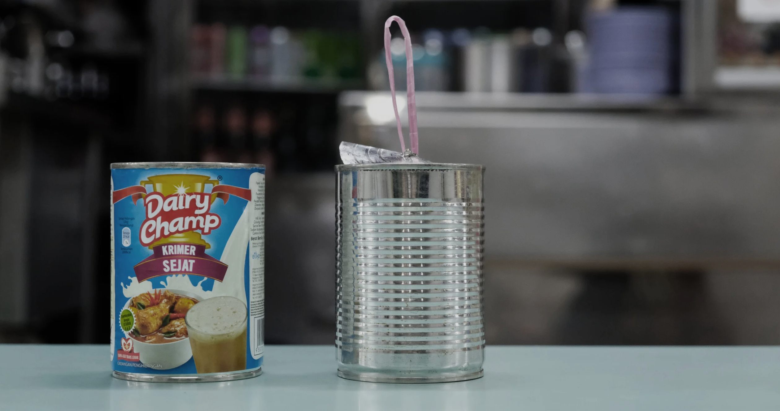 The milk tin alongside KopiCup